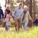 Happy multi-generation family walking in the countryside